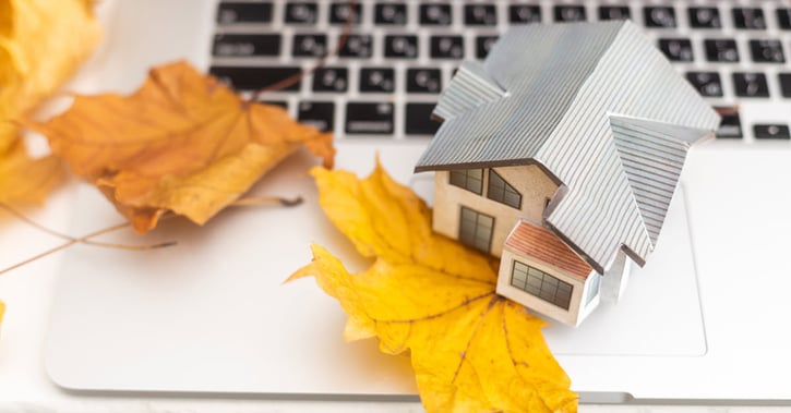 Autumn leaves and house on laptop